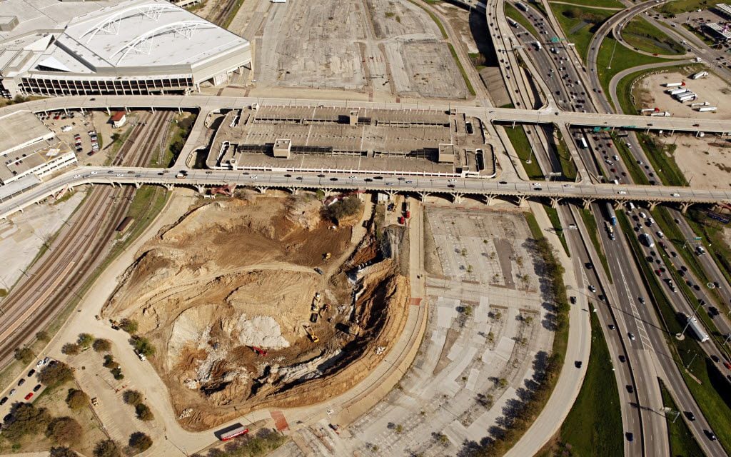 Aerial view of the hole in the ground and lot that formerly held Reunion Arena with I-35 on...