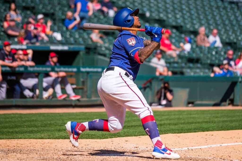 Texas Rangers outfielder Willie Calhoun flies out to right field during the eighth inning of...