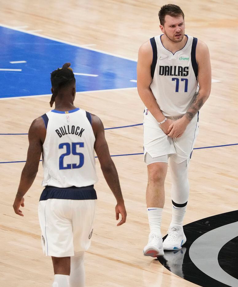 Dallas Mavericks guard Luka Doncic (77)reacts after being hit in the groin during the fourth...