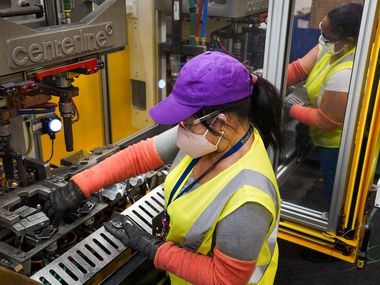 Sonia Benitez (foreground) and Isabel Rosario work a line at Flex-N-Gate in Grand Prairie, a facility that supplies parts for SUVs. Last month, U.S. manufacturers expanded at their fastest pace in 37 years, and Texas factories reported big gains in output, new orders, shipments and more.