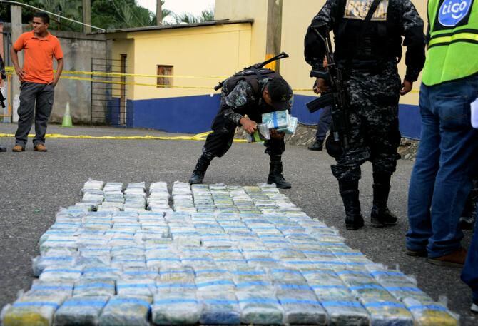 
Members of Honduras’ Special Unit against Drug Traffickng and Organized Crime arrange packs...