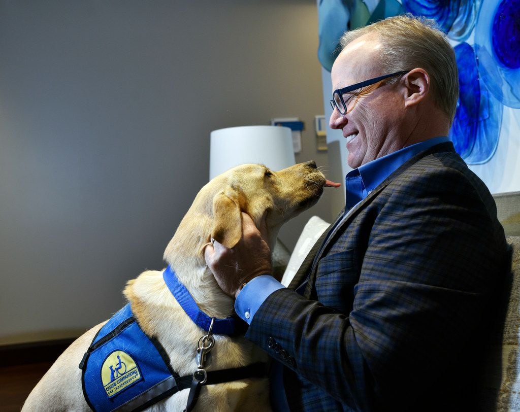 Jim Hinton meets a Labrador named Rivers from Canine Companions for Independence at the...