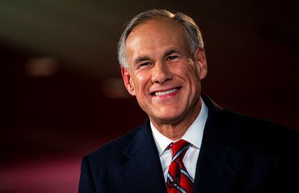 Texas Gov. Greg Abbott smiles before a gubernatorial debate against his Democratic...