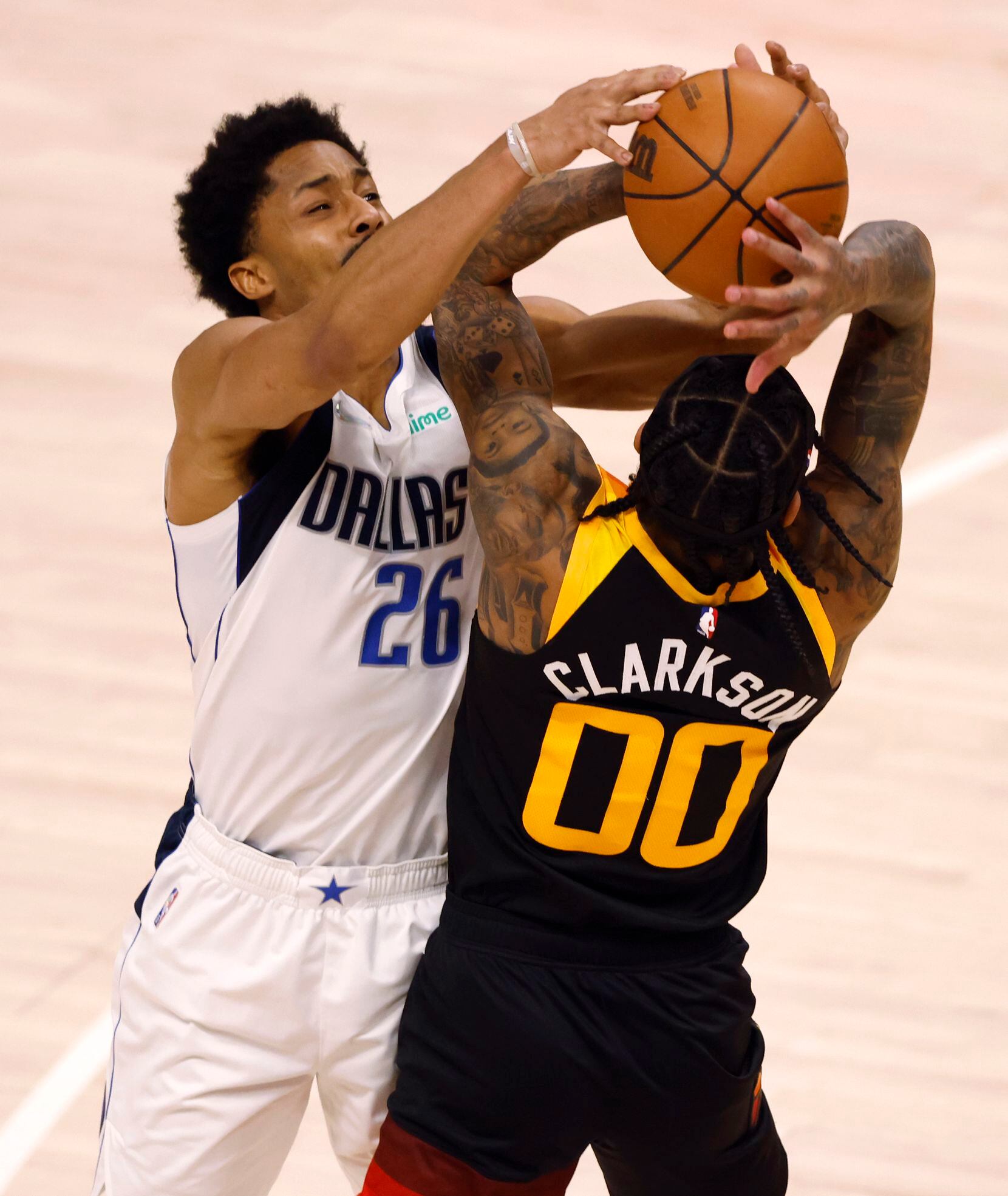 Dallas Mavericks guard Spencer Dinwiddie (26) attempts to knock the ball out of the hands of...