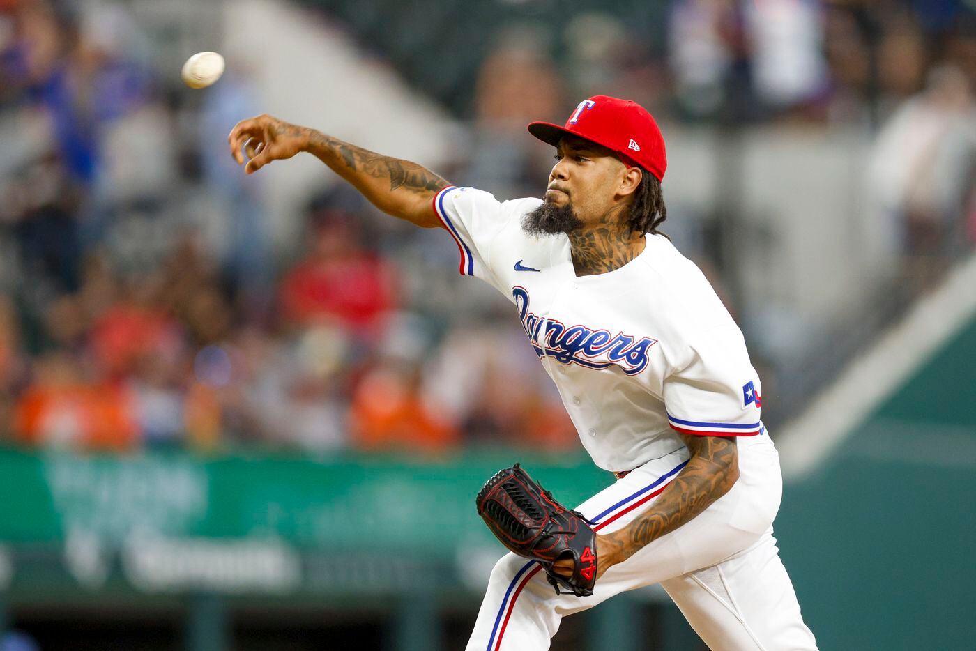 Texas Rangers relief pitcher Dennis Santana (19) delivers a pitch during the sixth inning of...