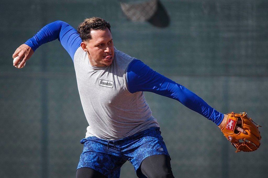 Texas Rangers infielder Asdrubal Cabrera takes infield practice during a spring training...