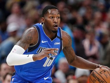 Dallas Mavericks forward Dorian Finney-Smith (10) plays against the Indiana Pacers during the first half of an NBA basketball game in Indianapolis, Monday, Feb. 3, 2020.