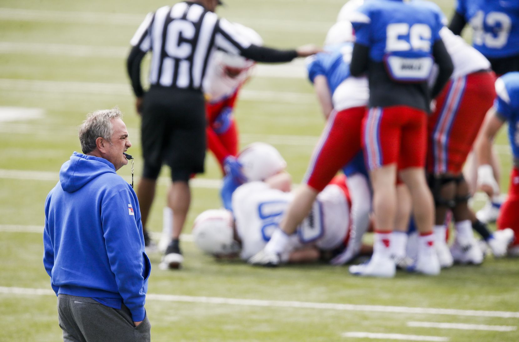 SMU head coach Sonny Dykes looks on during practice at Gerald Ford Stadium, Saturday, April...