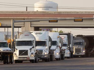 A line of drivers form as they head south toward the recently reopened Pharr–Reynosa...