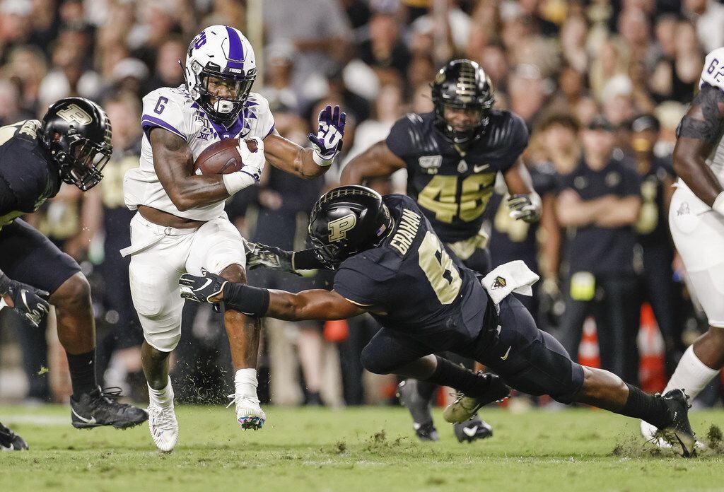 WEST LAFAYETTE, IN - SEPTEMBER 14: Darius Anderson #6 of the TCU Horned Frogs runs the ball as Jalen Graham #6 of the Purdue Boilermakers reaches for the tackle during the first half at Ross-Ade Stadium on September 14, 2019 in West Lafayette, Indiana. (Photo by Michael Hickey/Getty Images)