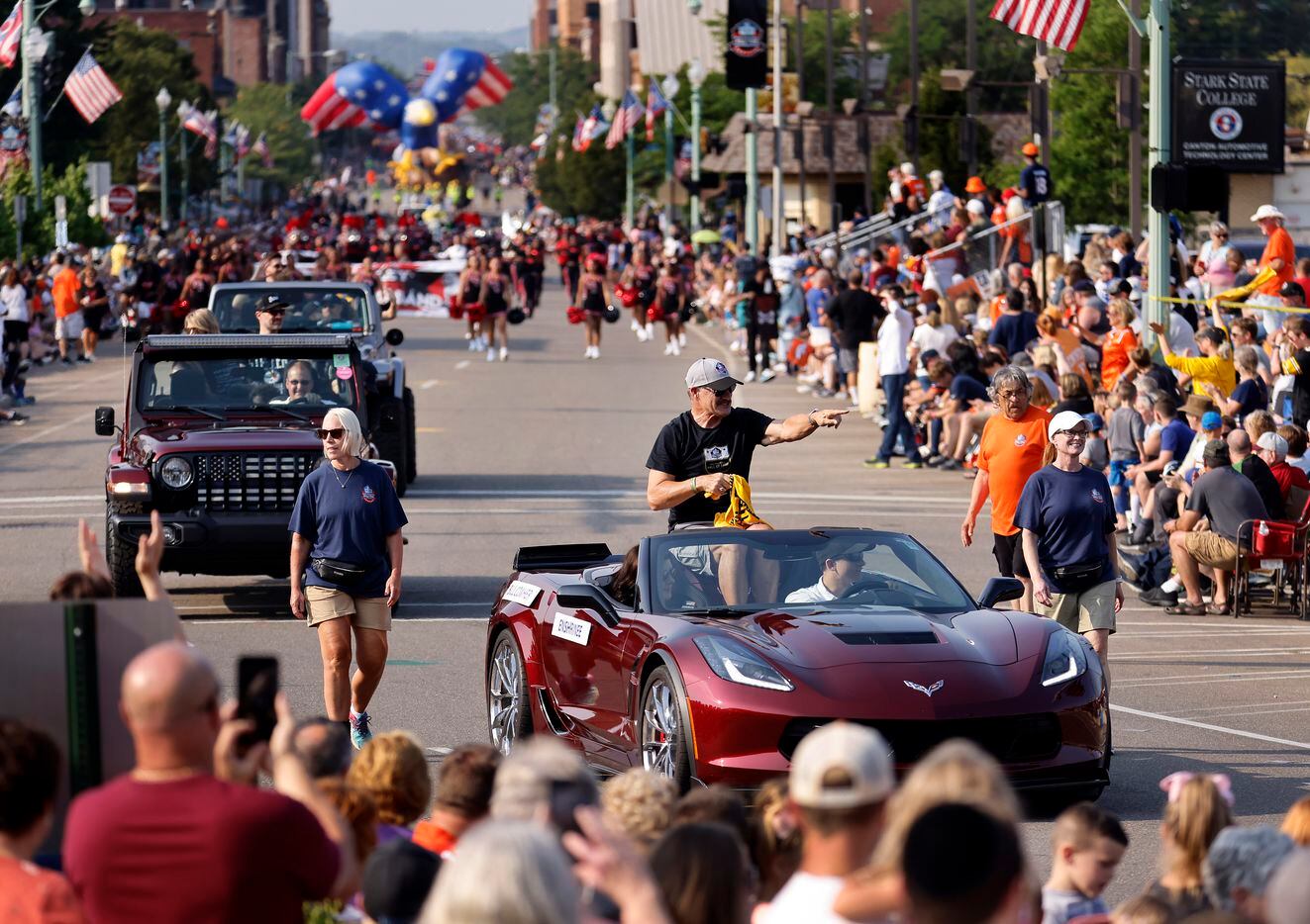 Pittsburgh Steelers Pro Football Hall of Fame inductee Bill Cowher points to his fans as he rides down Cleveland Ave during the Canton Repository Grand Parade in downtown Canton, Ohio, Saturday, August 7, 2021. The parade honored newly elected and former members of the Hall, including newcomers and former Dallas Cowboys players Cliff Harris, Drew Pearson and head coach Jimmy Johnson. (Tom Fox/The Dallas Morning News)