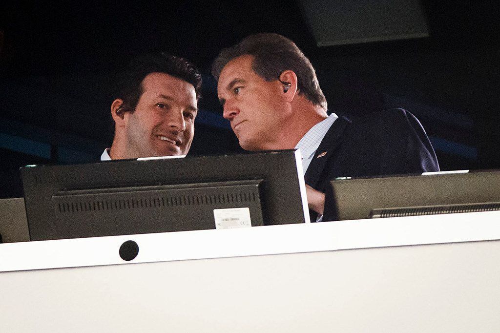 Tony Romo (left) works in the broadcast booth with  Jim Nantz during the first half an NFL...