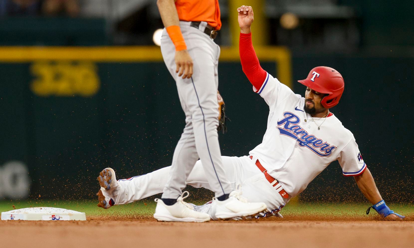 Texas Rangers second baseman Marcus Semien (2) safely steals second base during the first...