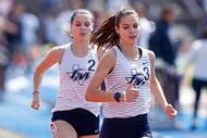 Flower Mound’s Samantha Humphries leads her sister Nicole Humphries in the girls 800 meter...