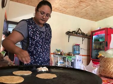 Yanet Lopez prepares quesadillas in her Guanajuato home, site of the upcoming Toyota plant...
