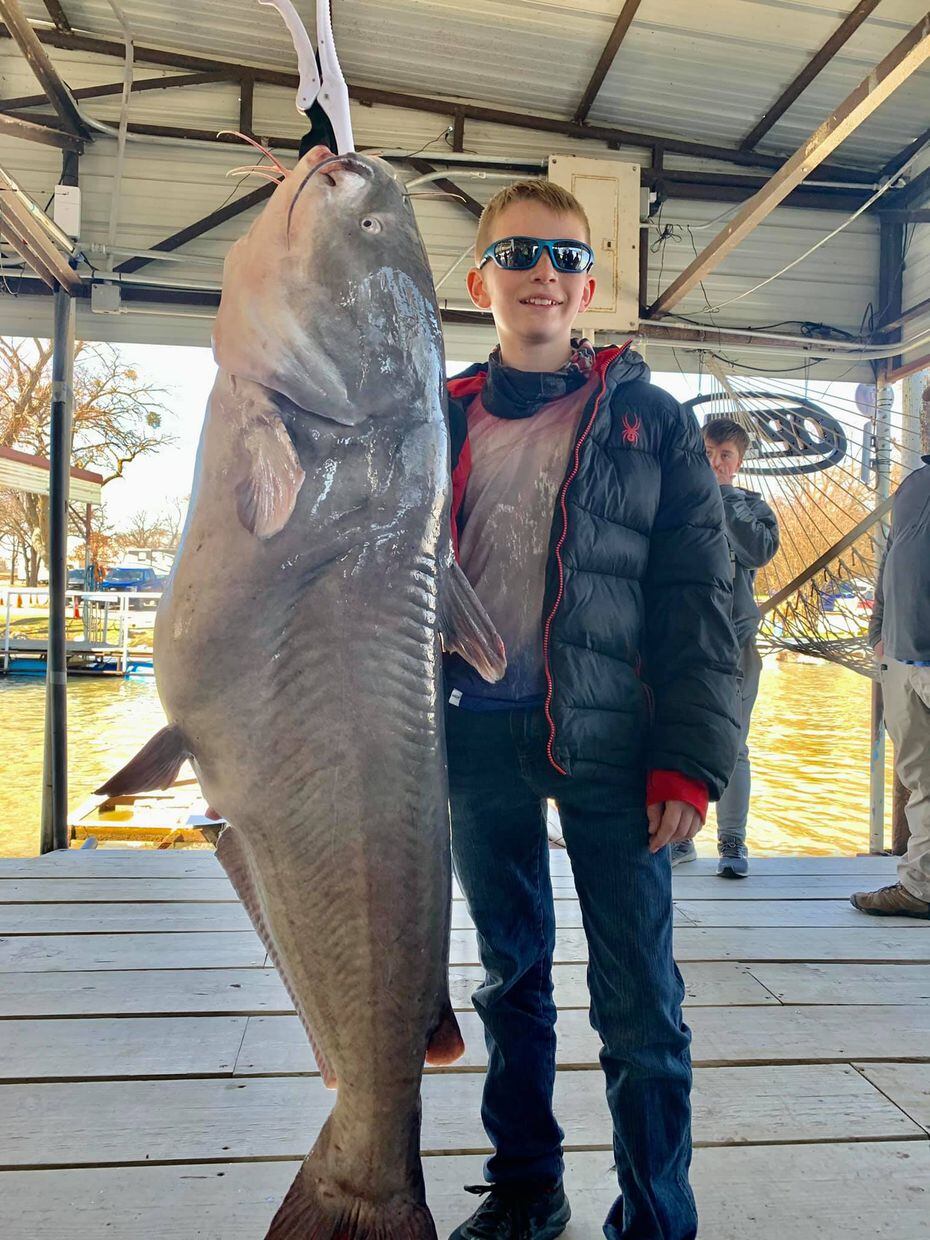 Cade Childress, 12, of Pickton, with the 72.4 pound blue cat he reeled in at Lake Tawakoni...