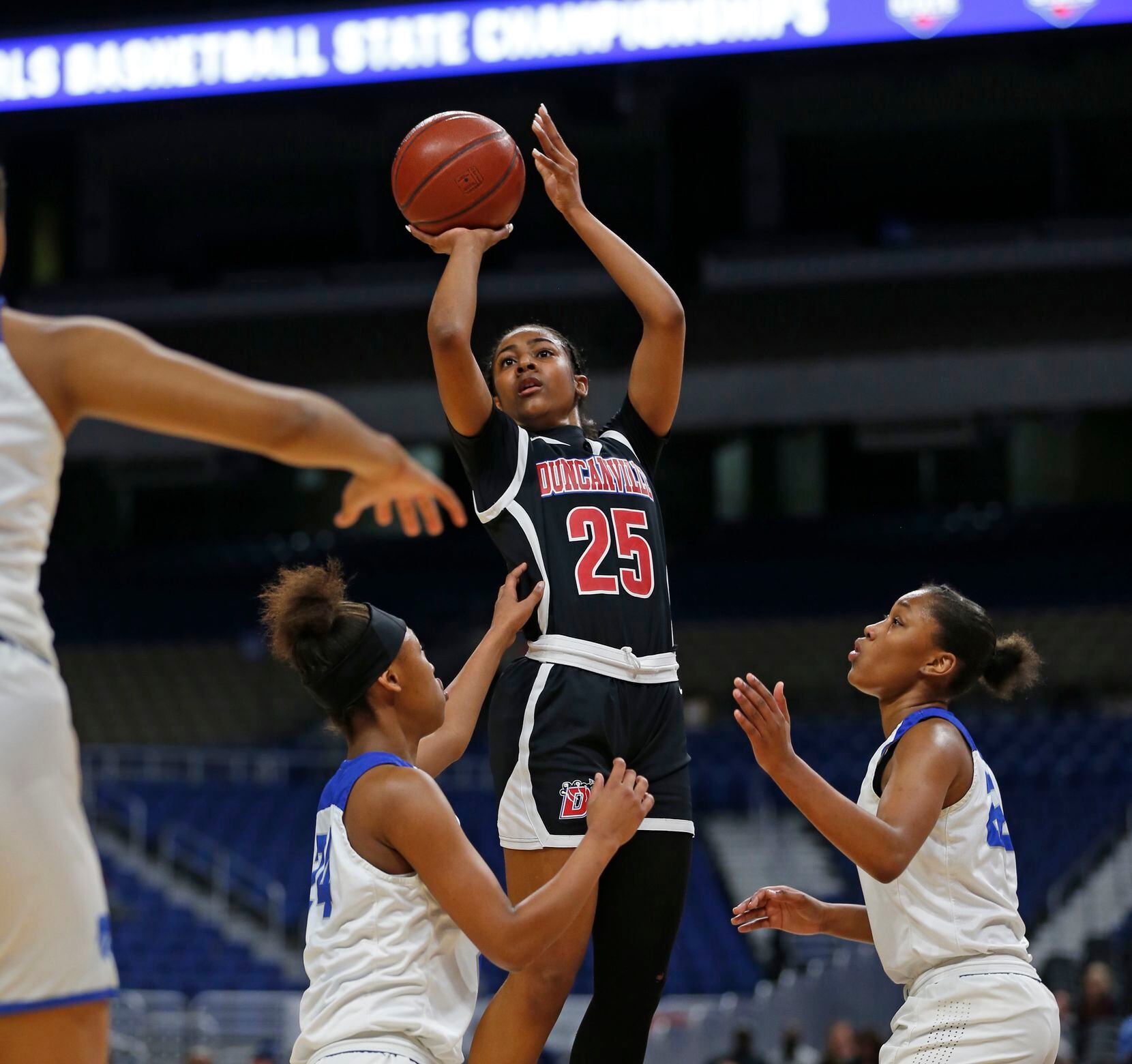 Duncanville guard Deja Kelly #25 scores two over Cypress Creek iin a 6A final on  Saturday,...