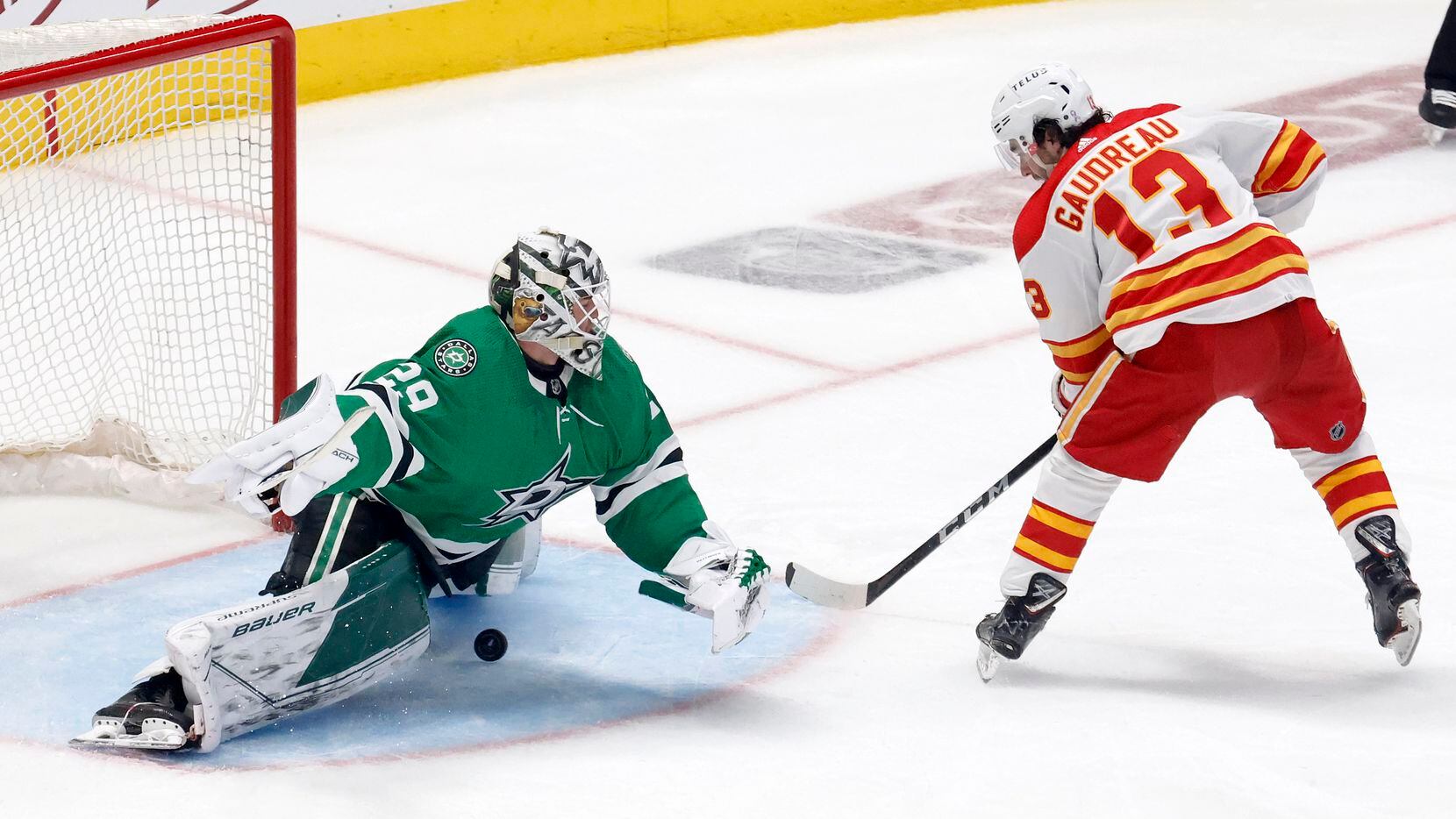 Calgary Flames left wing Johnny Gaudreau (13) scores a penalty shot on Dallas Stars...