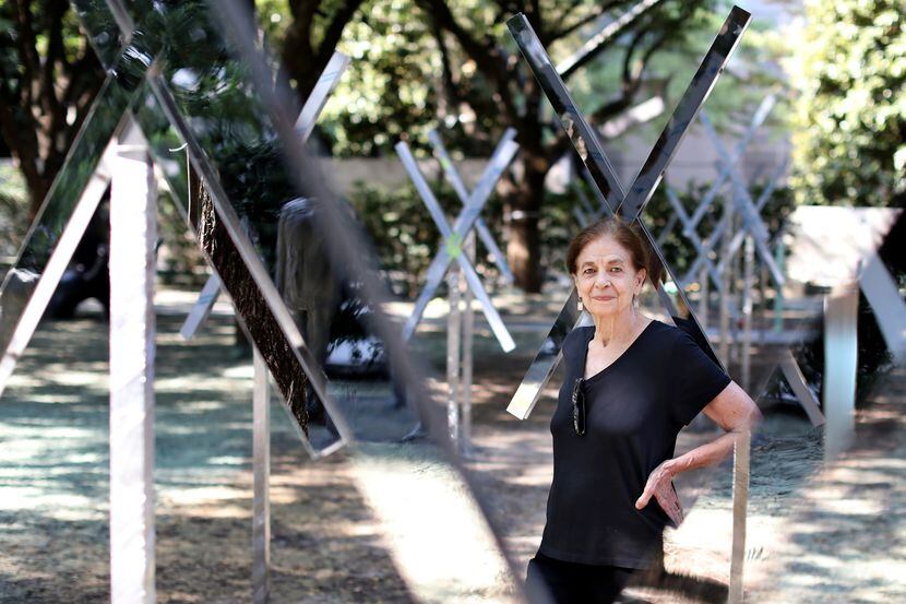 Artist Mary Miss poses for a photograph with her installation tracing the path of the buried...