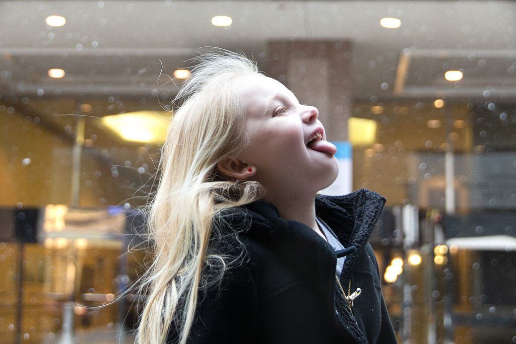 Karly Hentschel, 7, from La Grange, Texas, tries to catch a snowflake on her tongue after...