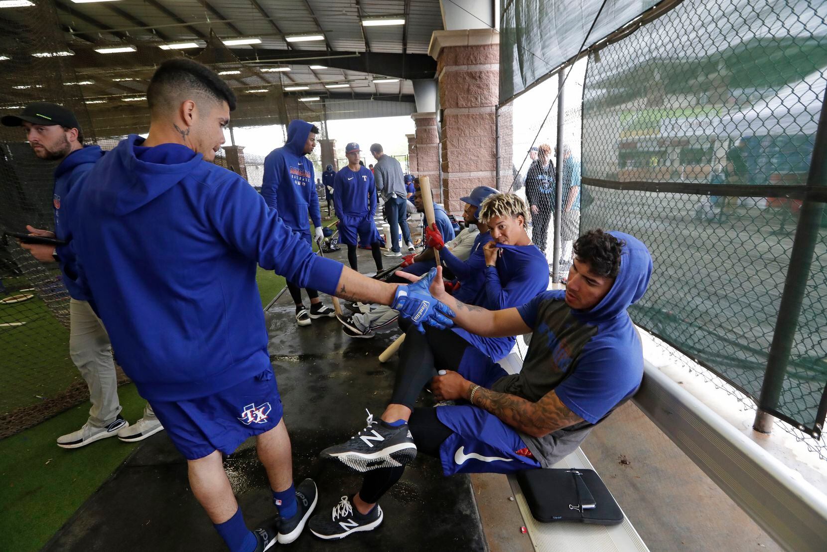 In this March 12, 2020, file photo, Texas Rangers minor-league players Chris Seise, right, ...