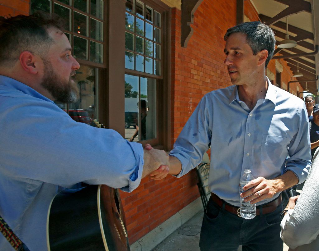 U.S. Rep. Beto O'Rourke, D-El Paso, right, shakes hands with supporter Isaac Hoskins, who...