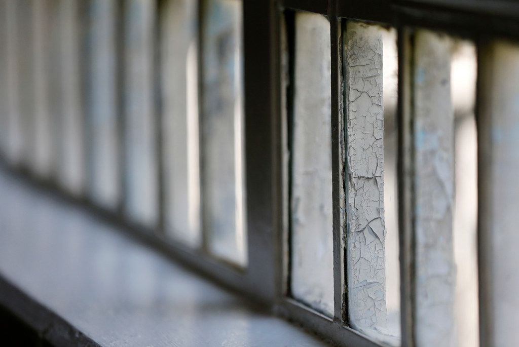 Cracked paint on a window pane in the COURAGE Program area of the O.B. Ellis Unit, a state...
