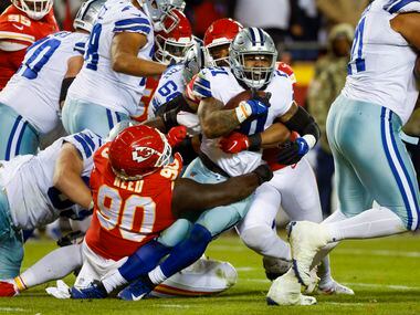 Kansas City Chiefs defensive tackle Jarran Reed (90) tackles Dallas Cowboys running back...