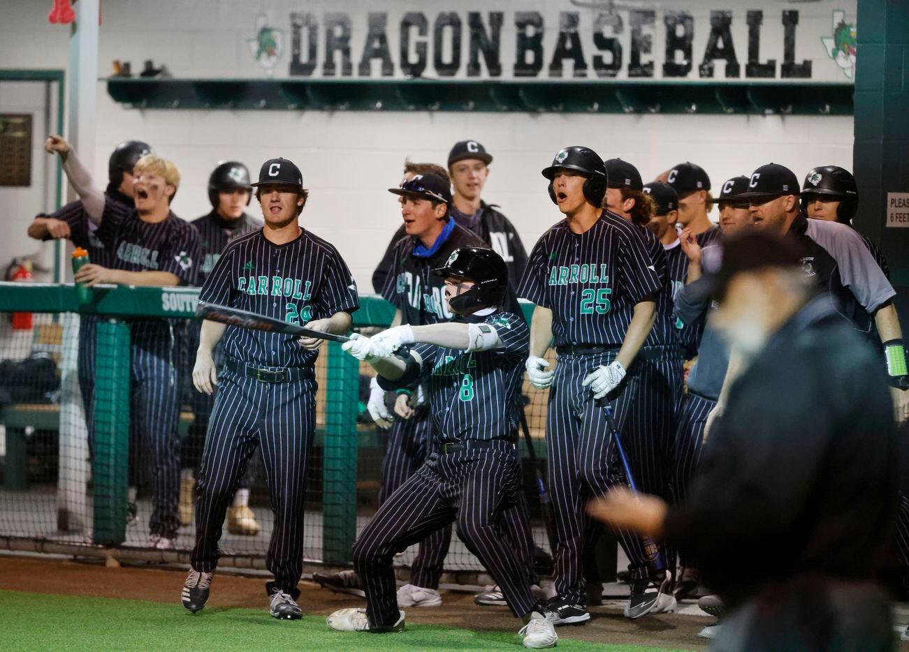 Southlake players, including Ryan Pehrson (8) celebrate as they scored one of three runs int he the 5th inning against Keller, during a Class District 4-6A baseball game in Southlake, Texas on March 19, 2021. (Michael Ainsworth/Special Contributor)