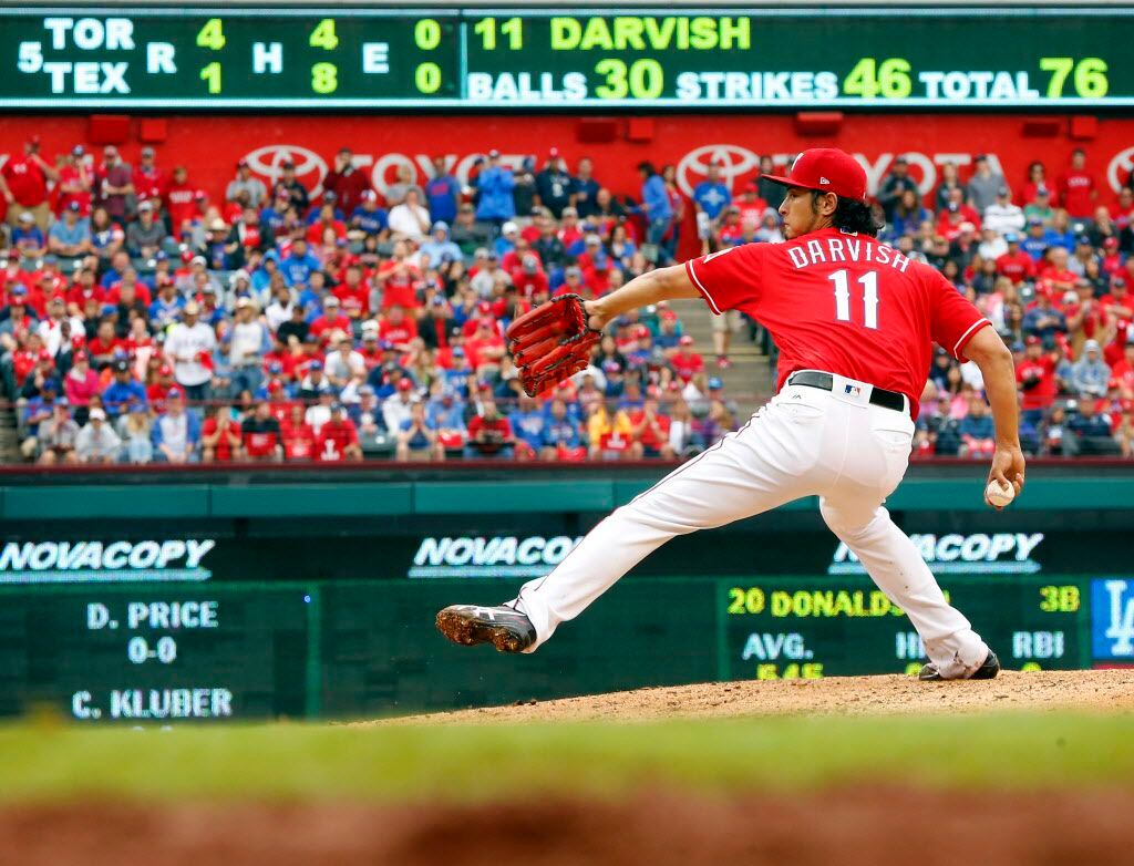 Texas Rangers starting pitcher Yu Darvish (11) throws against the Toronto Blue Jays during...