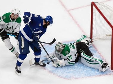 Esa Lindell (23) and goaltender Anton Khudobin (35) of the Dallas Stars defend against Pat Maroon (14) of the Tampa Bay Lightning during Game Two of the Stanley Cup Final at Rogers Place in Edmonton, Alberta, Canada on Monday, September 21, 2020.