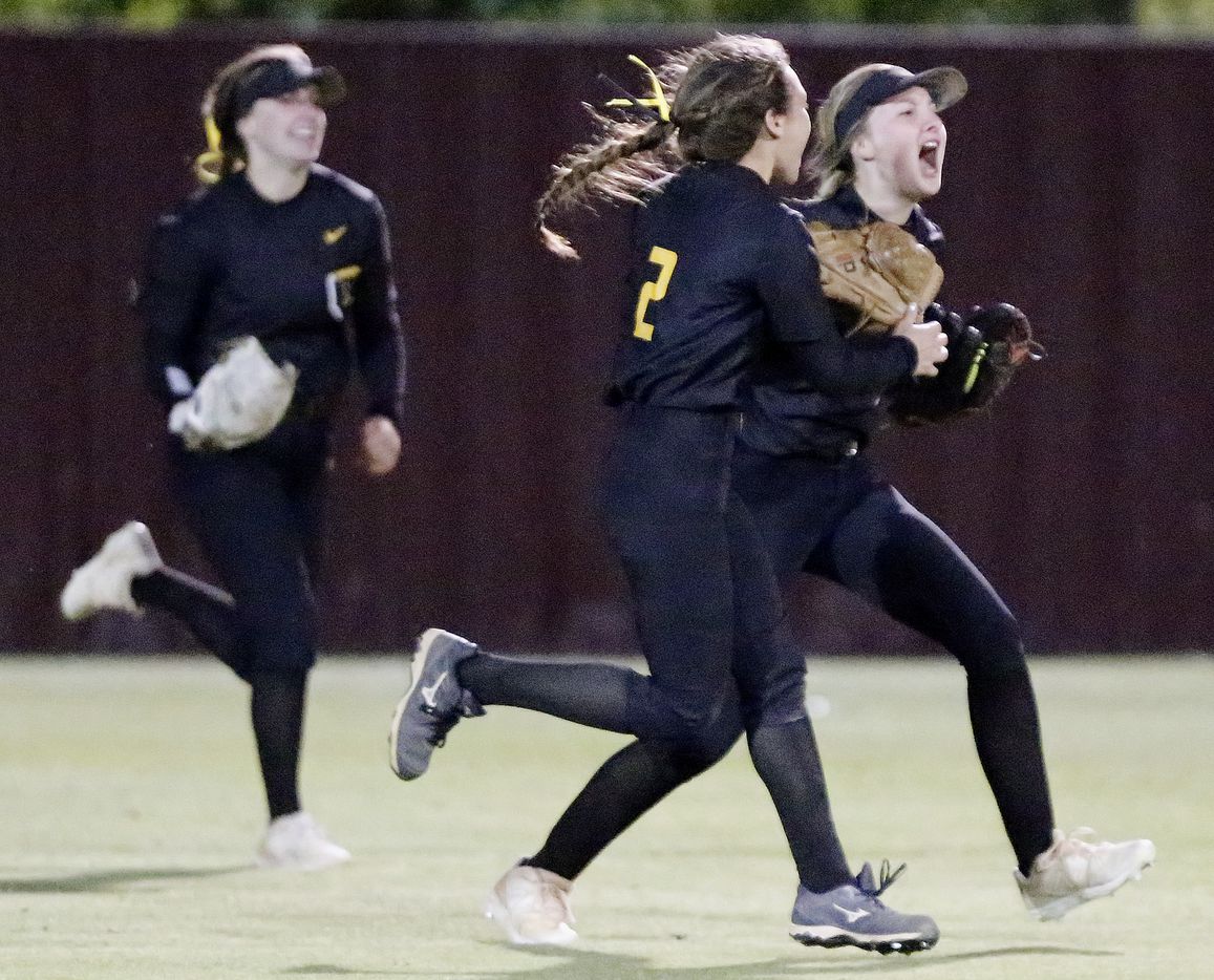 Memorial right fielder Gabby King (right) is met by second baseman Ashley Camacho (2) after King made a running catch to end the game and Memorial hung on to win 4-3 as Heritage High School hosted Memorial High School for the District 9-5A softball championship in Frisco on Tuesday, April 20, 2021. (Stewart F. House/Special Contributor)