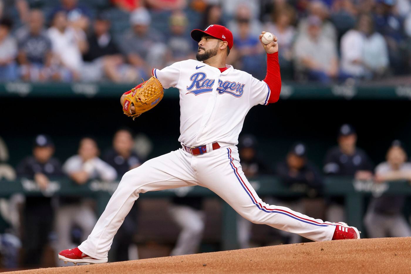 Texas Rangers starting pitcher Martin Perez (54) delivers a pitch during the first inning of...