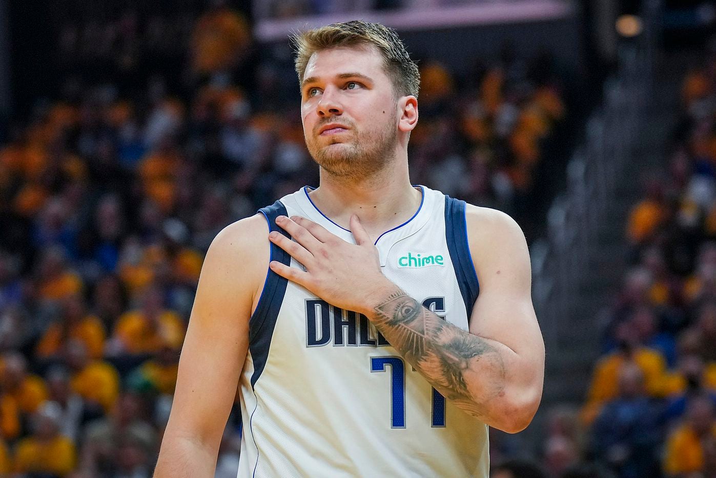 Dallas Mavericks guard Luka Doncic rubs his right shoulder after being fouled during the...