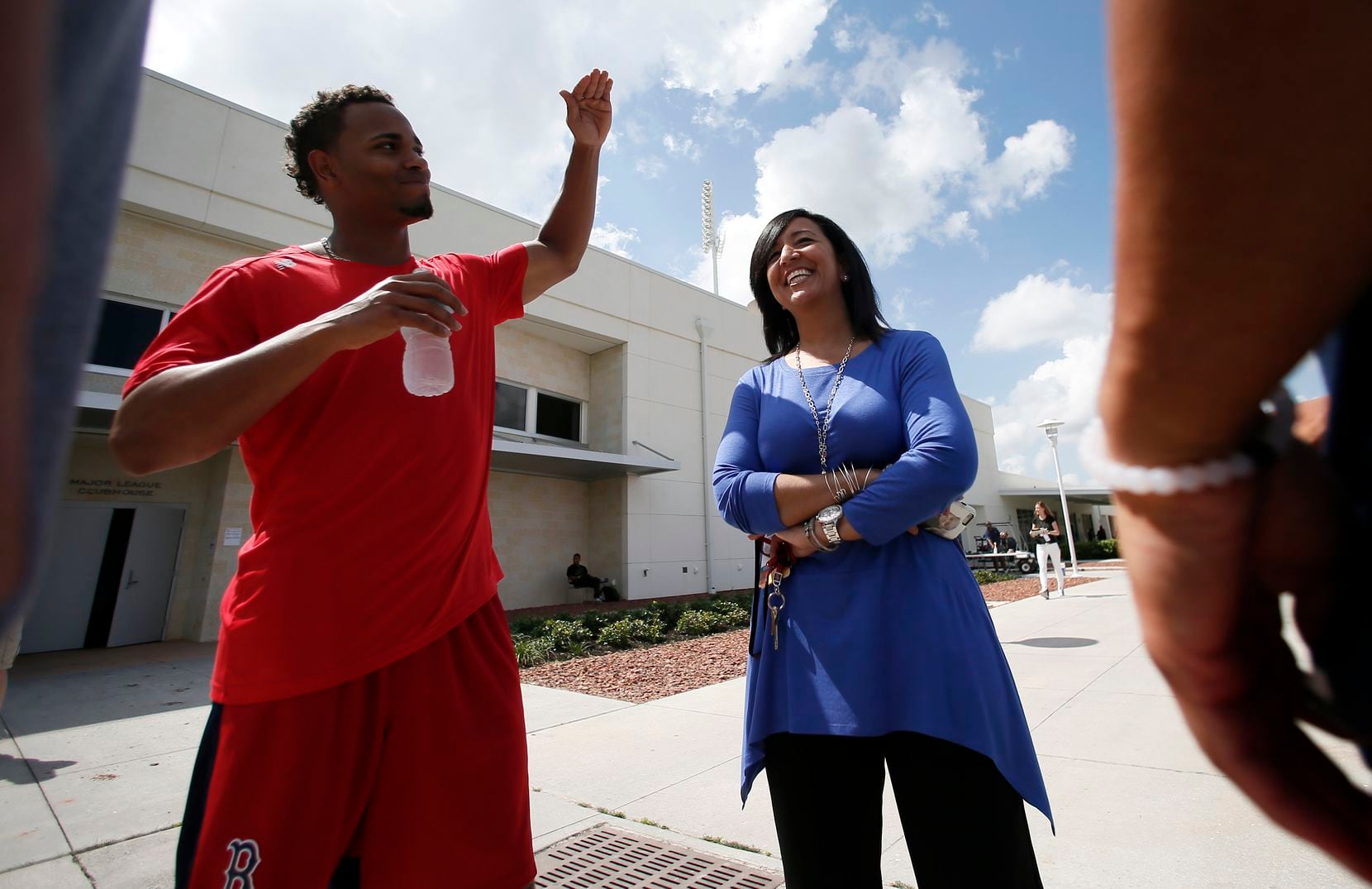 FILE - Boston Red Sox's Xander Bogaerts, left, talks with Raquel Ferreira, Red Sox Vice...