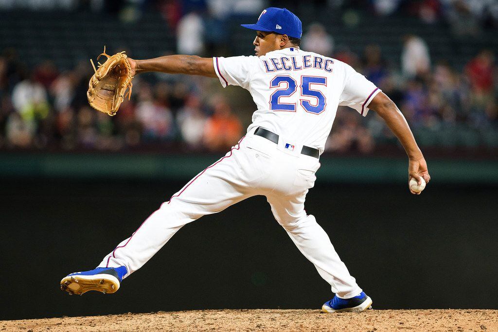 Texas Rangers pitcher Jose Leclerc throws during the ninth inning of a 6-4 win over the...