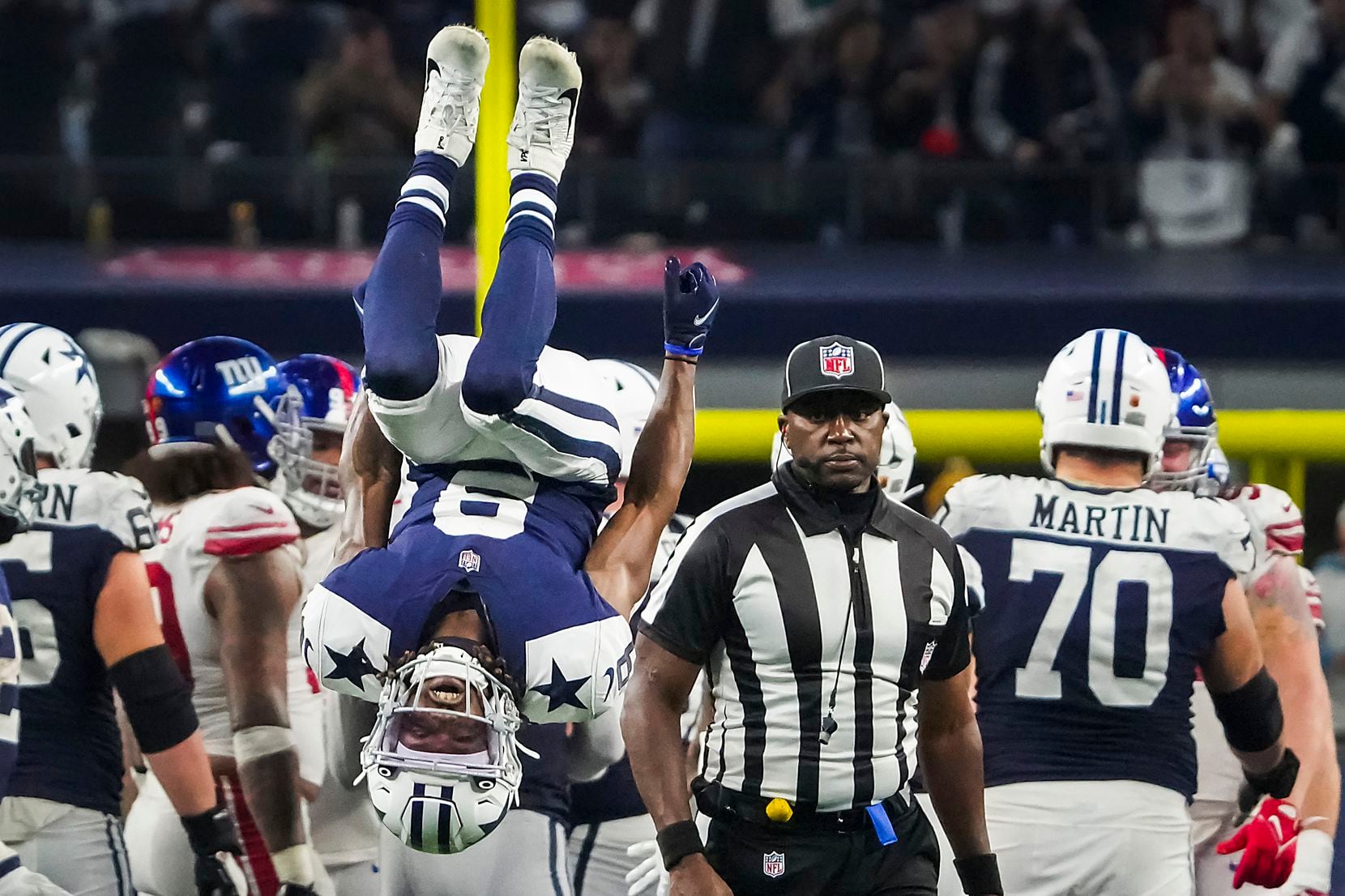 Dallas Cowboys wide receiver KaVontae Turpin (9) does a back flip in celebration as time...