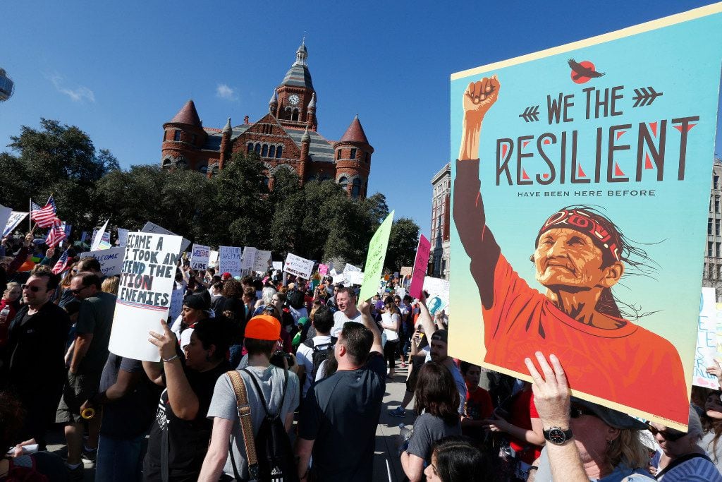 Protesters gathered to support  immigrant and refugee communities in downtown Dallas next to...