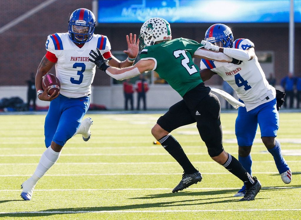 Duncanville wide receiver Zeriah Beason (4) provides cover for quarterback Ja'Quinden Jackson (3) as he breaks past Southlake Carroll defensive back Dylan Thomas (2) during the first half of a Class 6A Division I Region I high school football matchup between Southlake Carroll and Duncanville on Saturday, Dec. 7, 2019 at McKinney ISD Stadium in McKinney, Texas. (Ryan Michalesko/The Dallas Morning News)