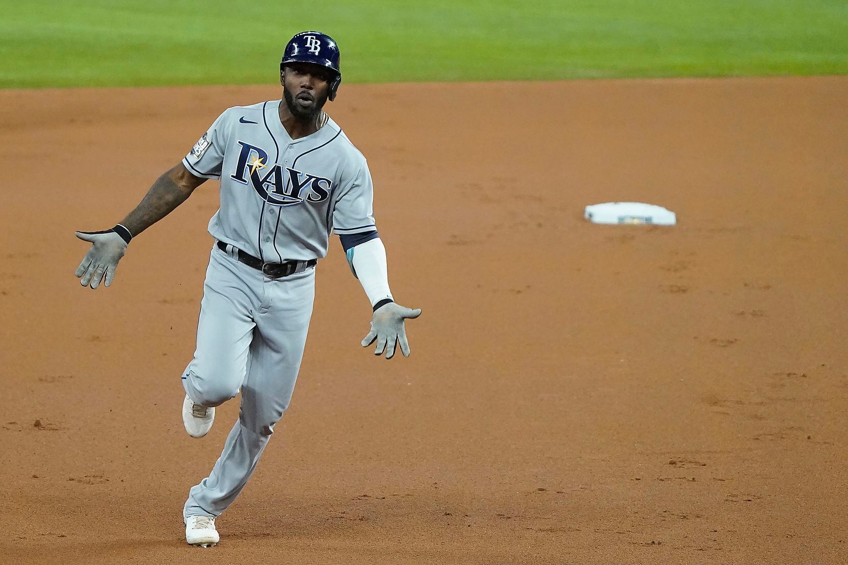 Tampa Bay Rays left fielder Randy Arozarena rounds the bases after hitting a solo home run...