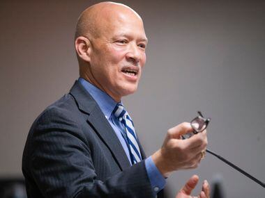District Attorney John Creuzot cracks a few jokes Tuesday during a swearing-in ceremony at...