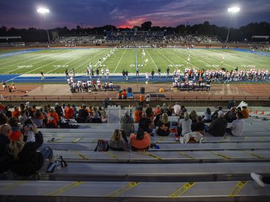 Every other row is cordoned off in the visitors’ bleachers during a high school football game between Jesuit and Rockwall on Friday, October 2, 2020 at Postell Stadium in Dallas.