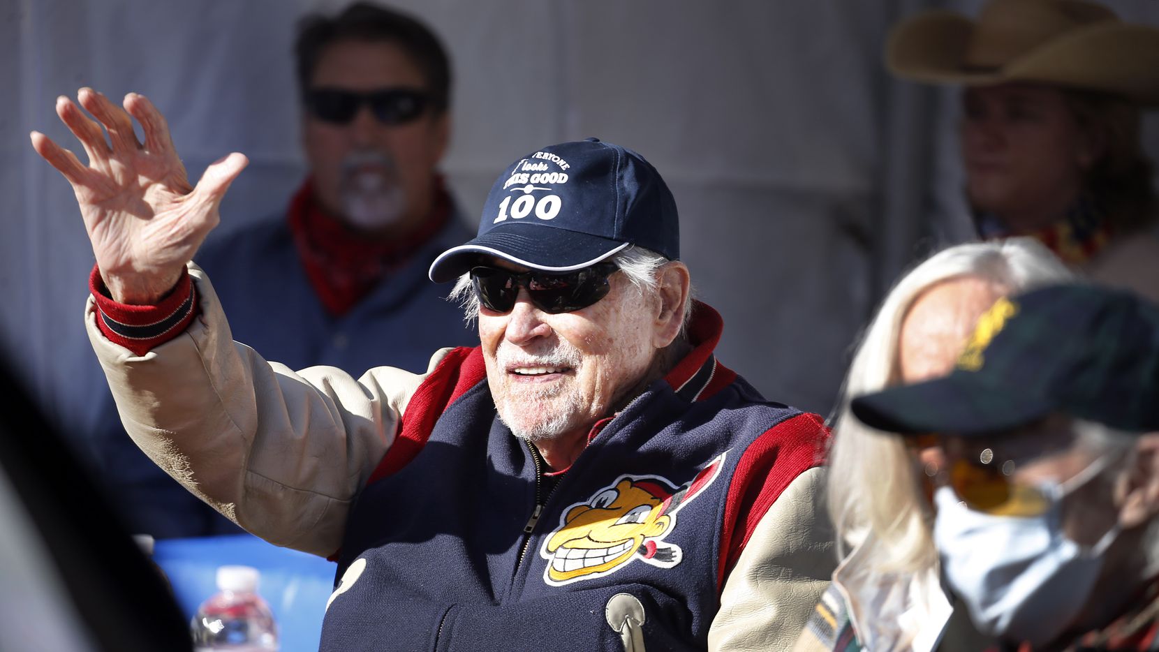 Eddie Robinson, the oldest living former MLB player, waves to friends who delivery an early...