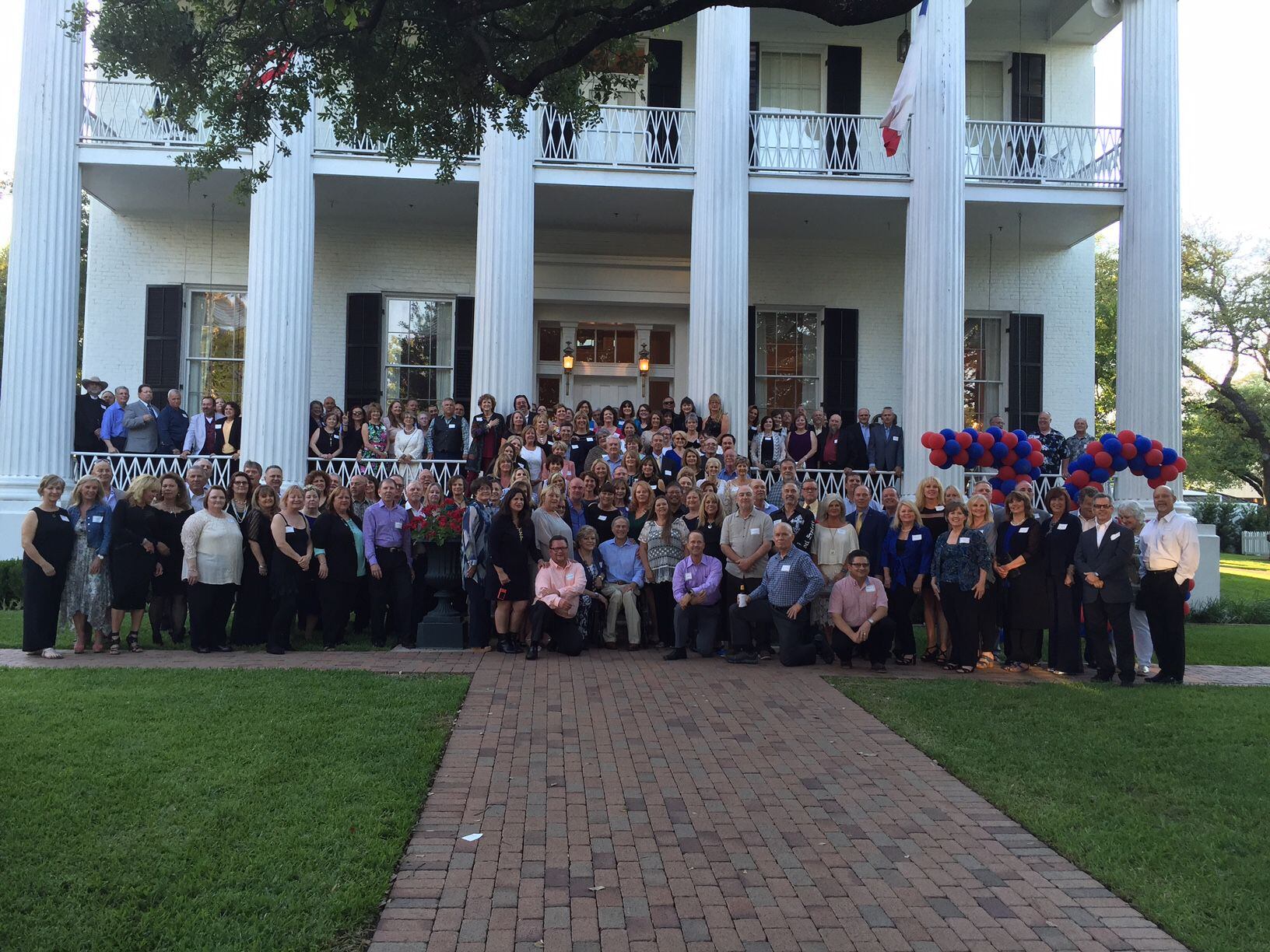  Duncanville High School class of 1976 gathered with Gov. Greg Abbott on the lawn of the...