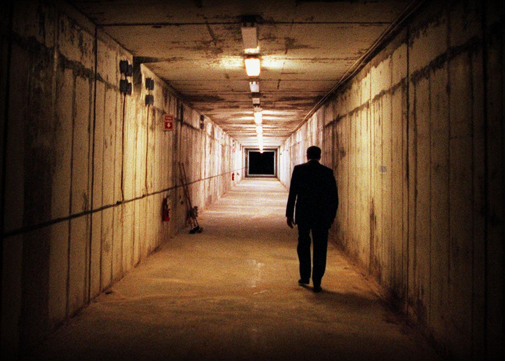 Texas General Land Office Facilities Manager J. Richard Fielder walks down the tunnel of the abandoned Super Collider in 2005.
