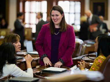 Rep. Erin Zwiener, D-Driftwood, talks with other representatives on the third day of the...