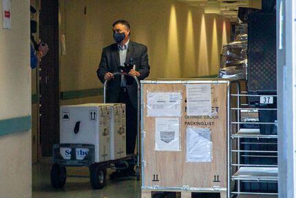 VP and Chief Pharmacy Officer Jon Albrecht receives a shipment of the Pfizer COVID-19...