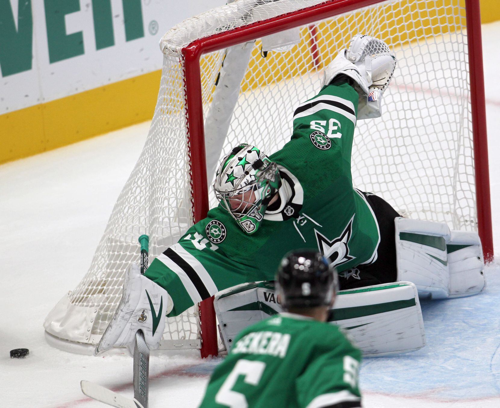 Dallas Stars goalie Anton Khudobin (35) stretches as he guards against a loose puck during...