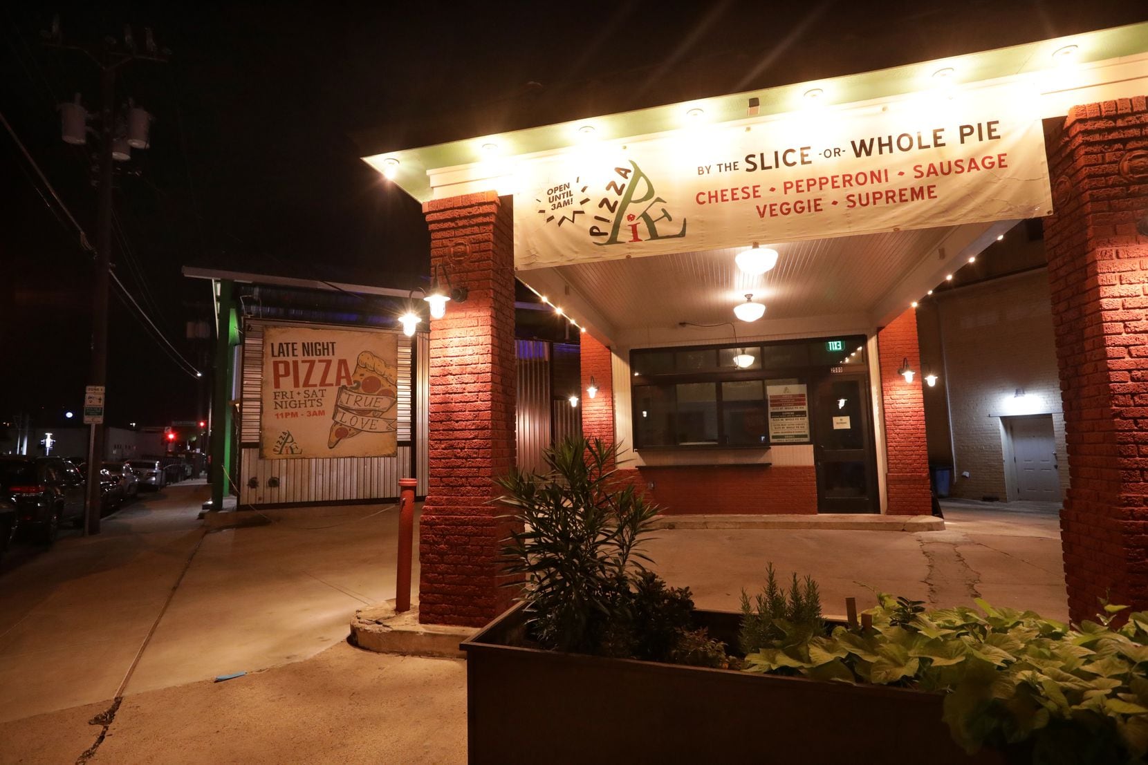 On the back side of Bottled Blonde in Deep Ellum is a late-night pizza place. It wasn't in...
