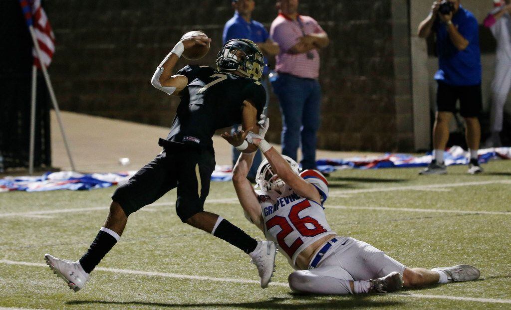 Birdville's Hosea Armstrong (7) is taken down by Grapevine's Keegan Courtney (26), drawing a...